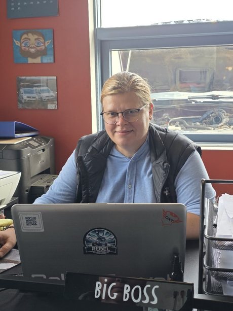 Gosia at her desk in the Mountain Car workshop